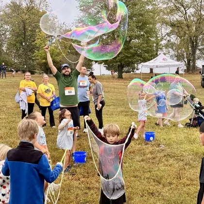 Kids making giant bubbles at a bubble party