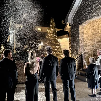 Falling snow at an evening winter event