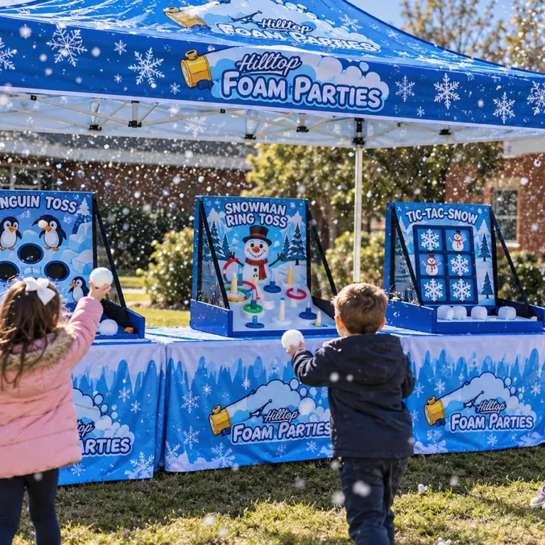 Kids tossing snowballs at Penguin Toss, Snowman Ring Toss and Tic-Tac-Snow games at a Hilltop snow party