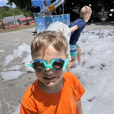Happy camper in goggles at a summer foam party