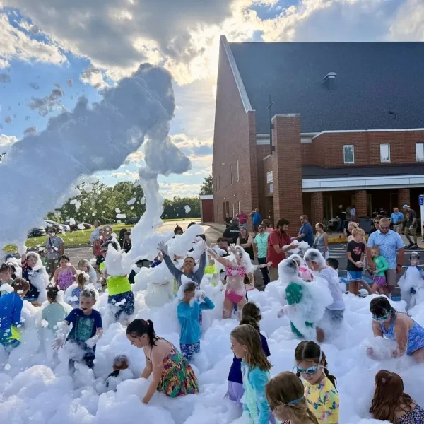 Foam cannon covering kids at a church VBS event