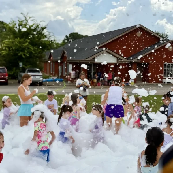 Kids at a Discovery Lane Day School summer foam party