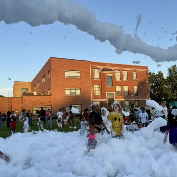 Families at a back-to-school foam party at KIPP Academy Nashville