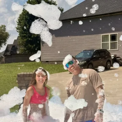 Neighbors playing in foam at a block party